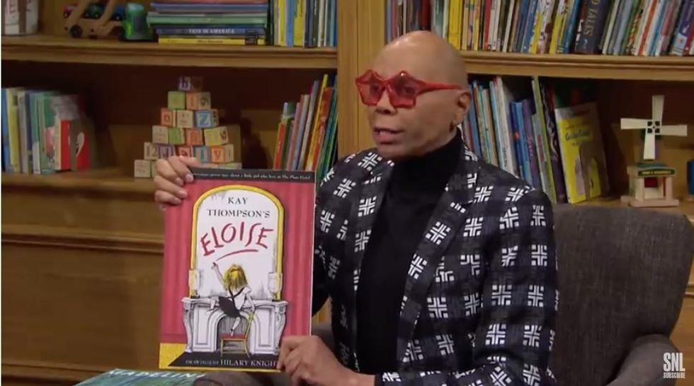 RuPaul reading a book
