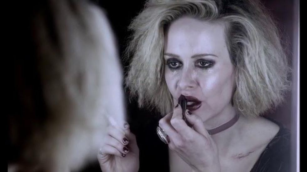 Sally McKenna putting on lipstick