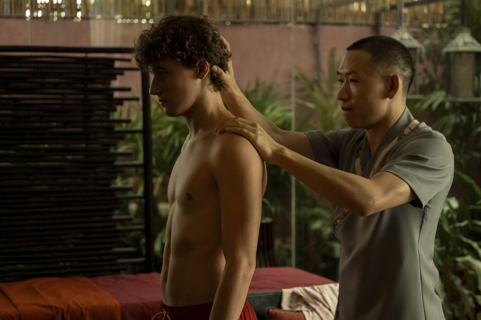 Sam Nivola getting his neck massaged on "The White Lotus"