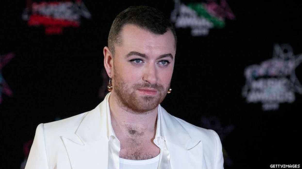 Sam Smith on a red carpet.