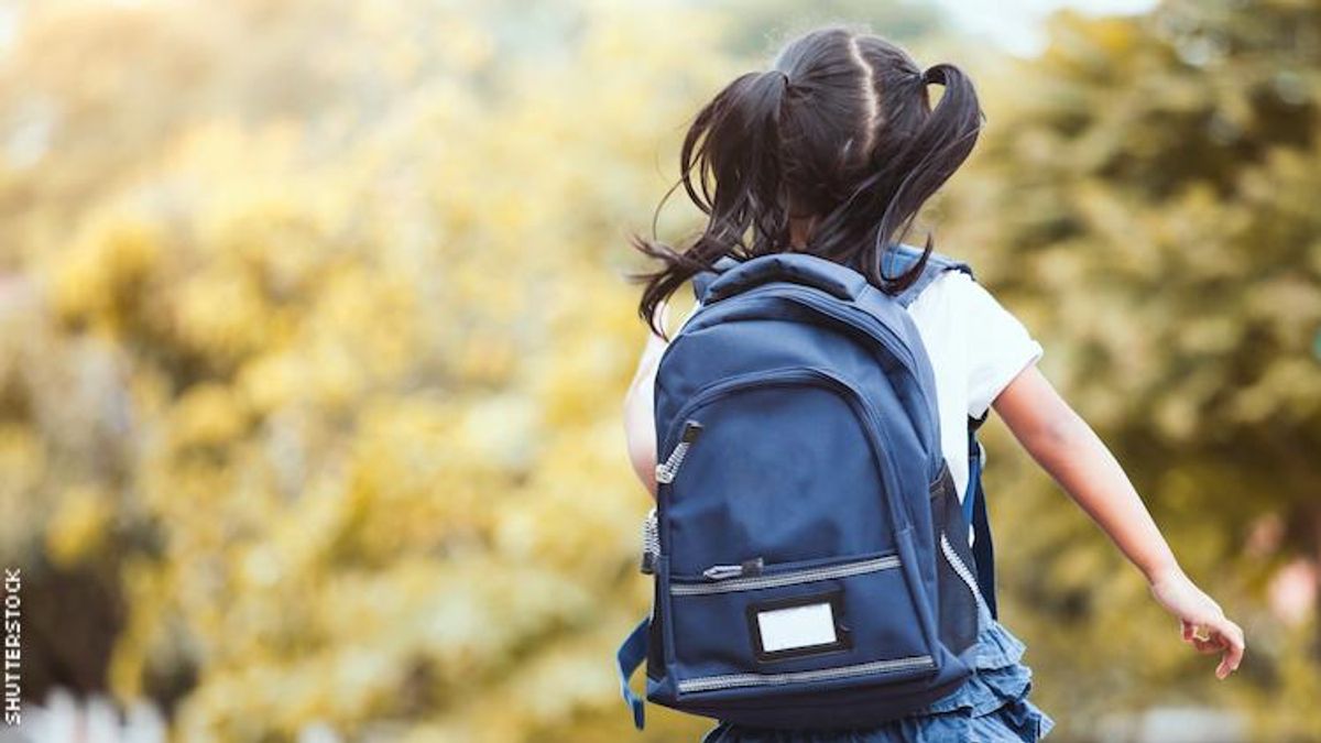 Schoolgirl with her backpack.