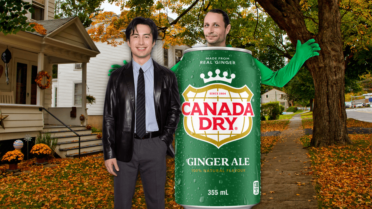 Shane Hollander with a man wearing a costume made to look like a giant can of Ginger Ale