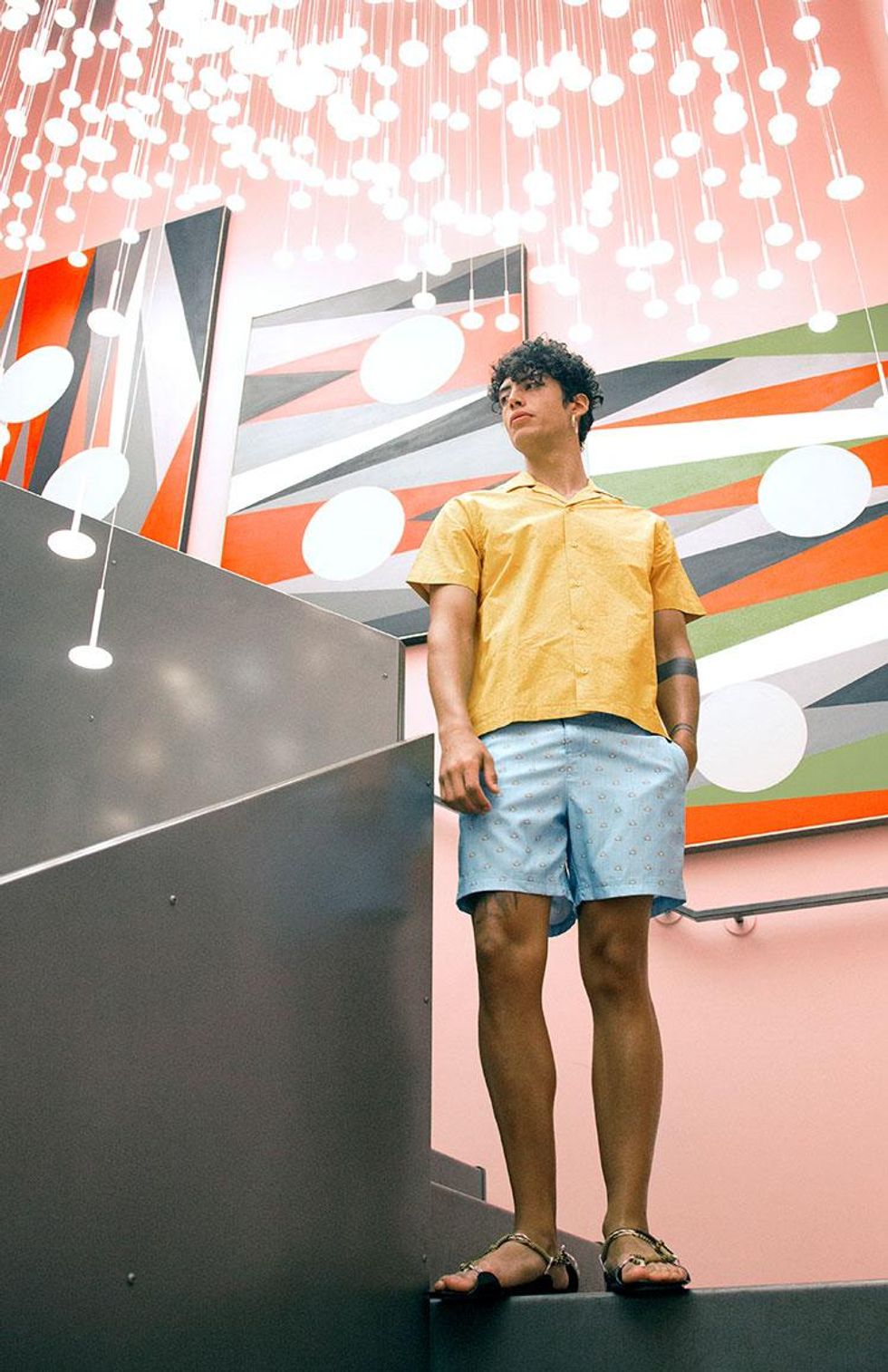 Shirt by Saturdays NYC, $225; Swim shorts by Original Penguin, $79; Sandals by Jil Sander, $720.