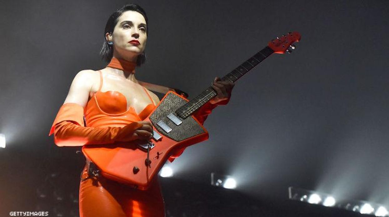 St. Vincent performing at a concert.