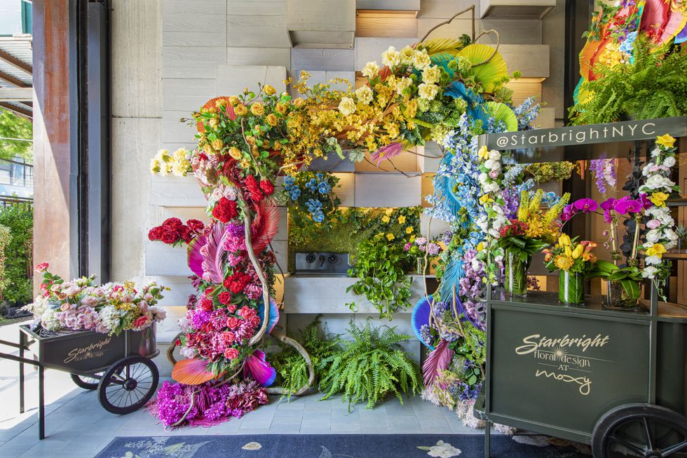 Starbright Floral Design transforms the entrance of Moxy Chelsea into a joyful riot of color