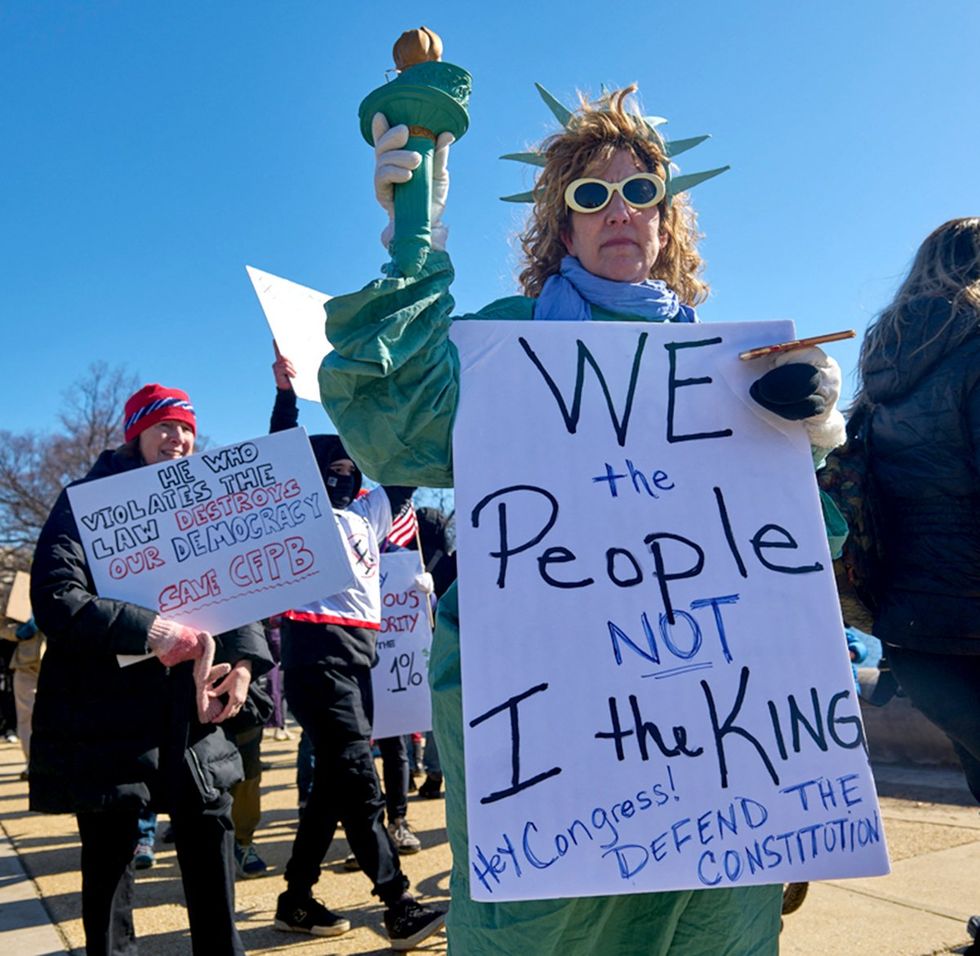 statue of liberty protester at the captiol building february 2025