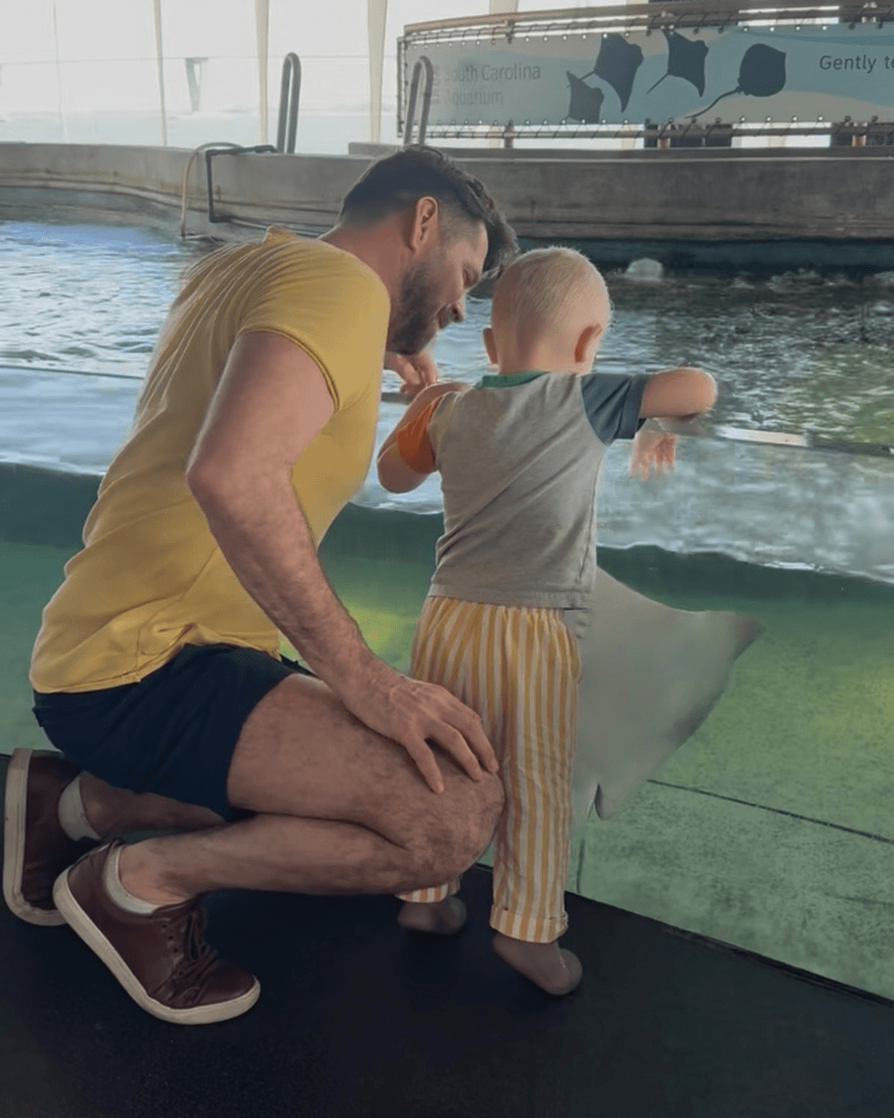 Stephen and Theo look at the stingrays