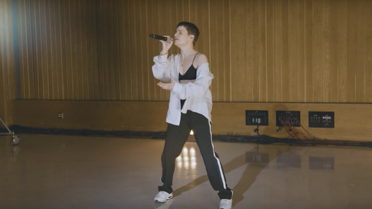 Still from Christine and the Queens' new music video performing "Girlfriend" live.