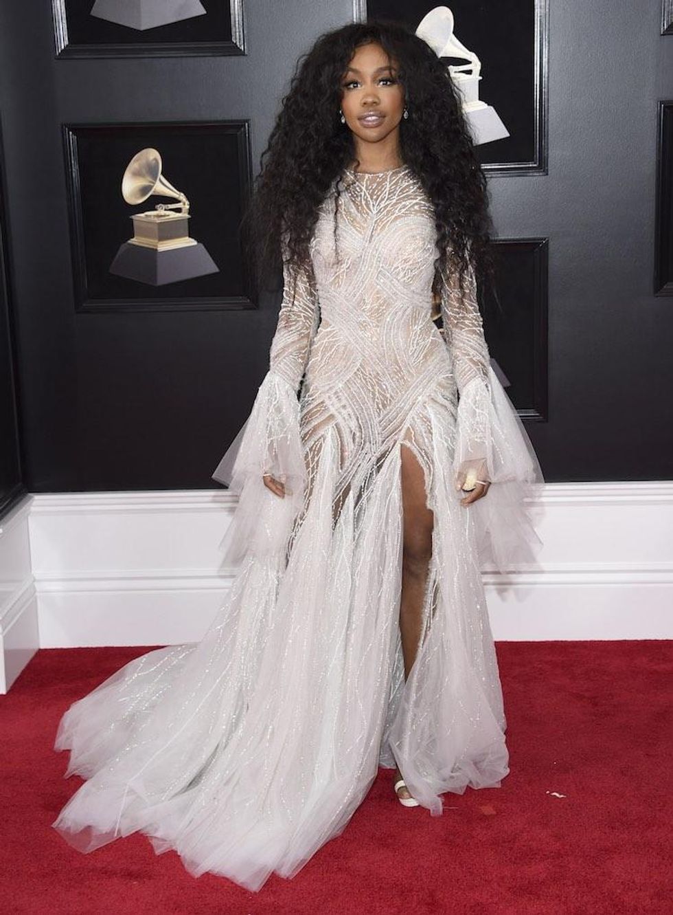 Sza in a Feathery Cher-Like Creature