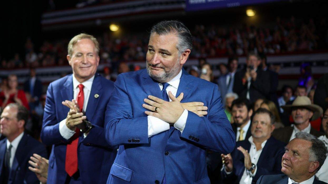 ted cruz gesturing next to ken paxton