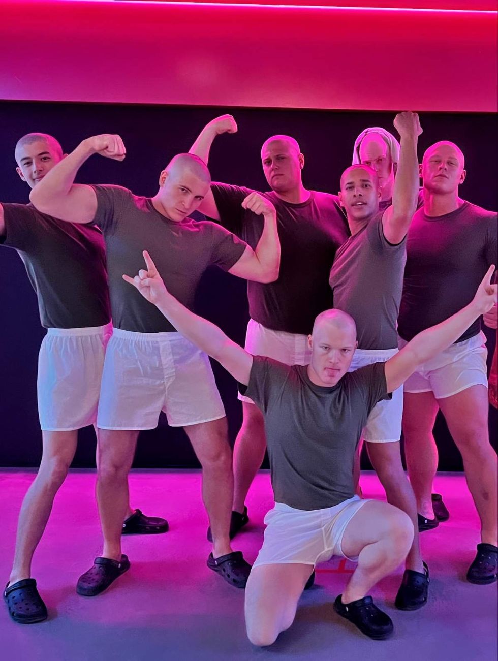 The actors, alongside an in-drag Miles Heizer, on set while filming Boots