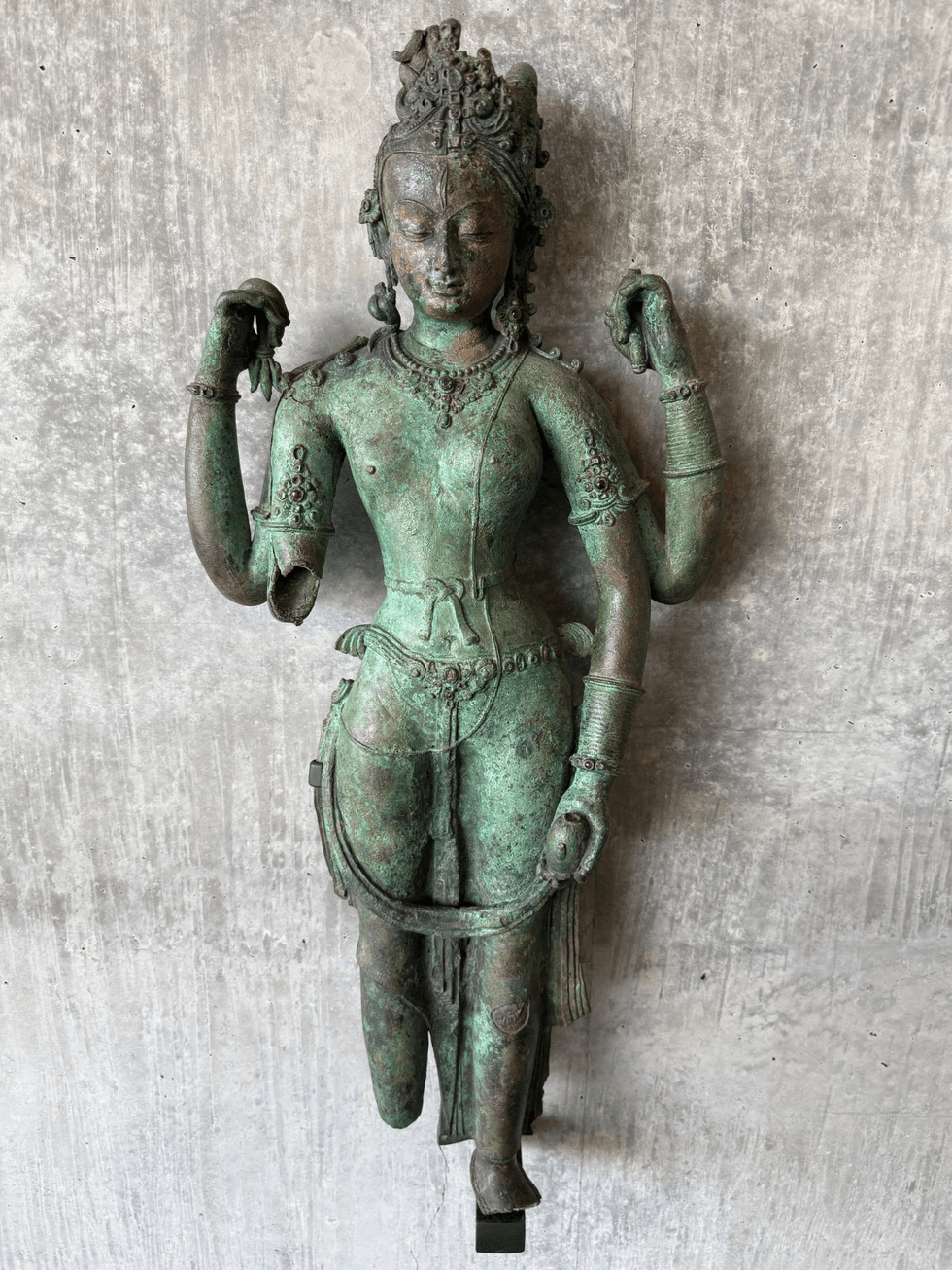 The Androgynous Form of Shiva and Parvati (Ardhanarishvara), a circa-1000 Nepalese bronze sculpture combining the male Shiva and female Parvati in a single figure.