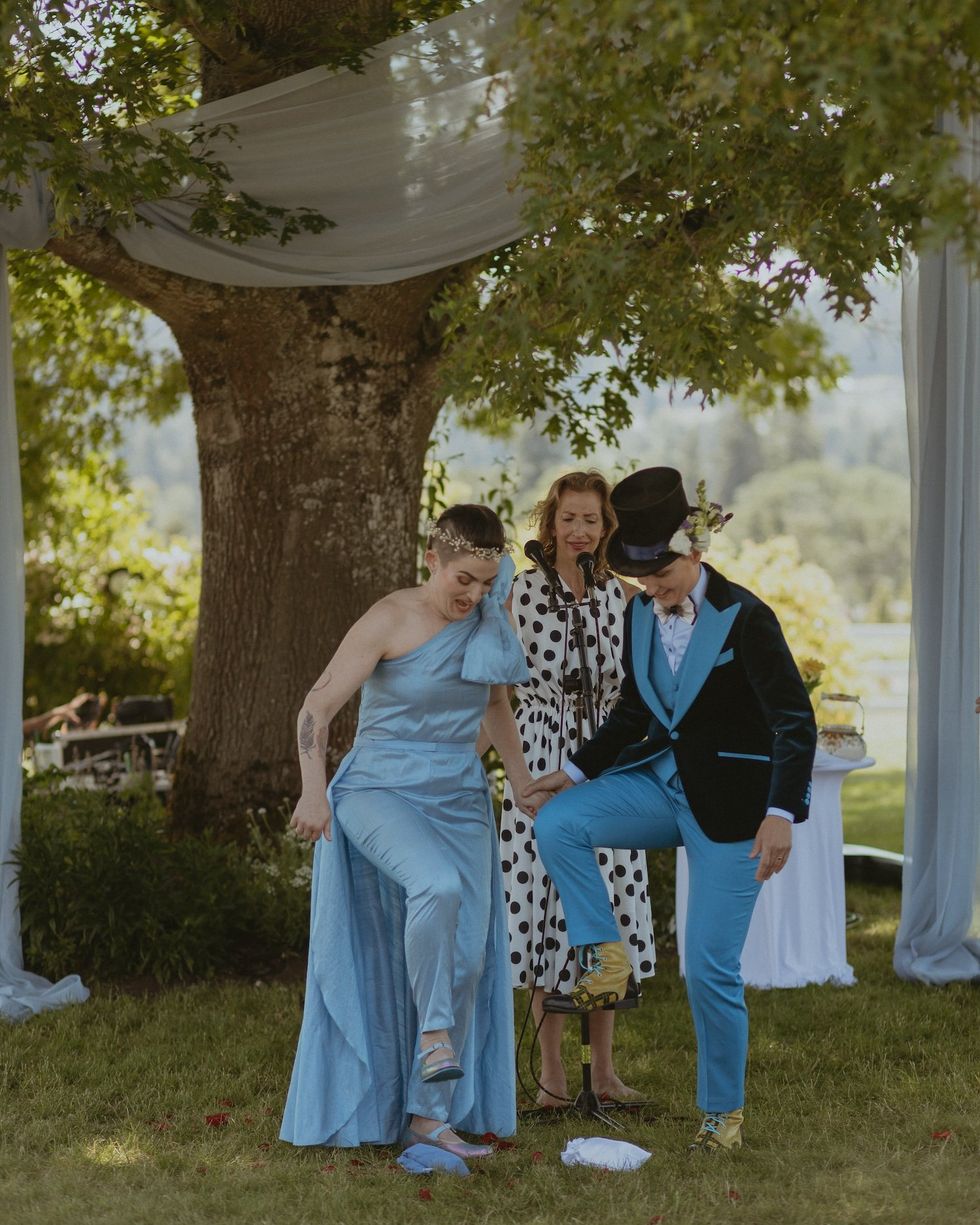 The couple break the glass, a Jewish wedding ritual in which one or both individuals step on wrapped glass to signify the end of the ceremony.