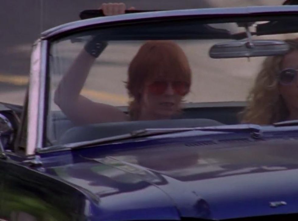 The Crazed, Red-Eyed Girl in the Passenger Seat