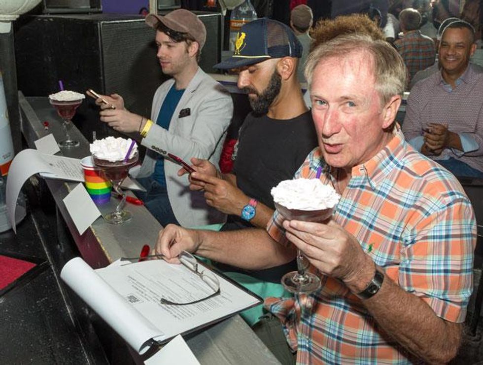 The judges taste their cocktails.