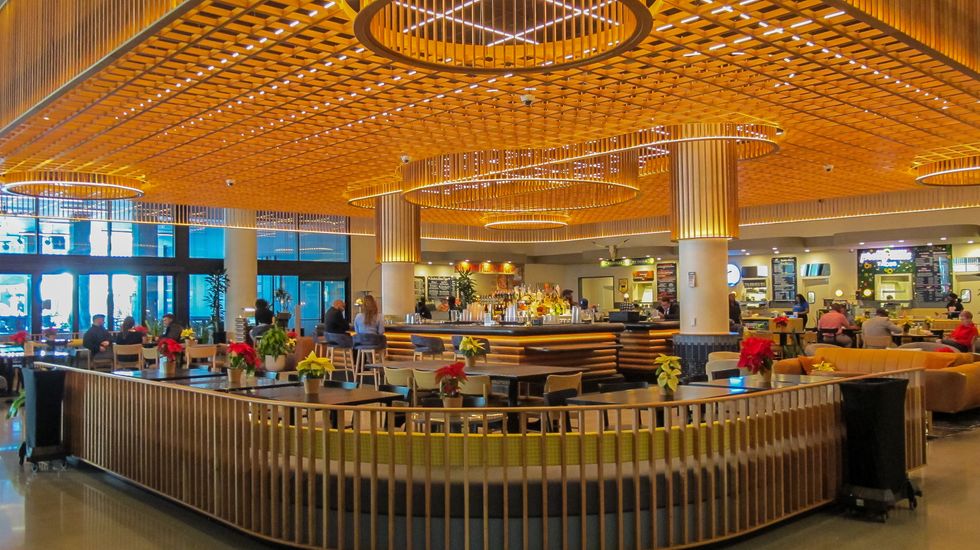 The sleek, central bar anchors Politan Row\u2019s chef-driven food hall