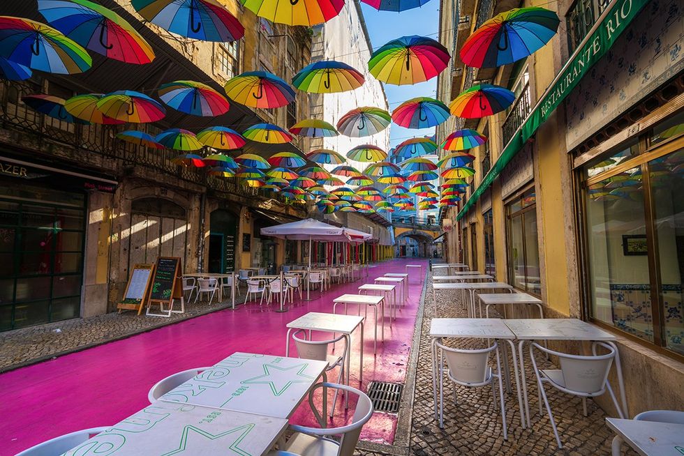 The top 10 queer-friendly cities in the world \u2013 No. 1. Lisbon, Portugal (Lisbon\u2019s famed \u201cPink Street\u201d with rainbow Pride umbrellas)