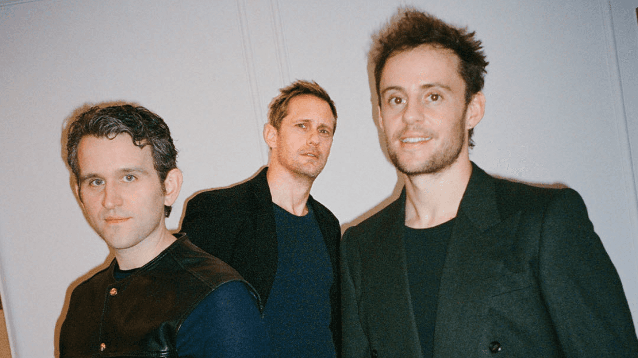 Three men posing and looking at the camera