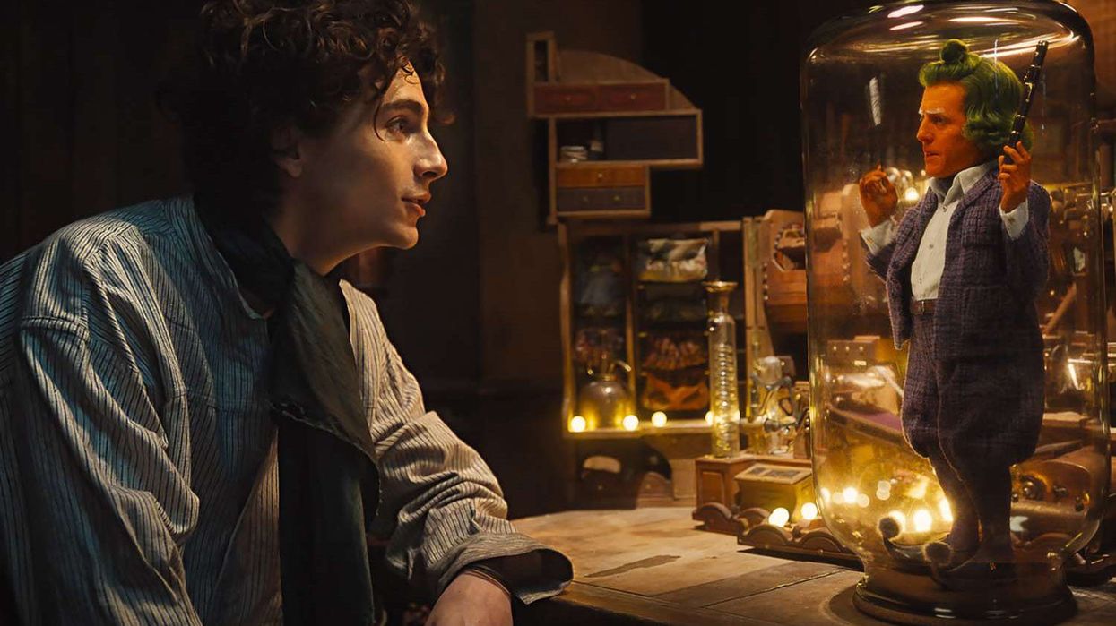 Timothée Chalamet with an Oompa Loompa in 'Wonka'