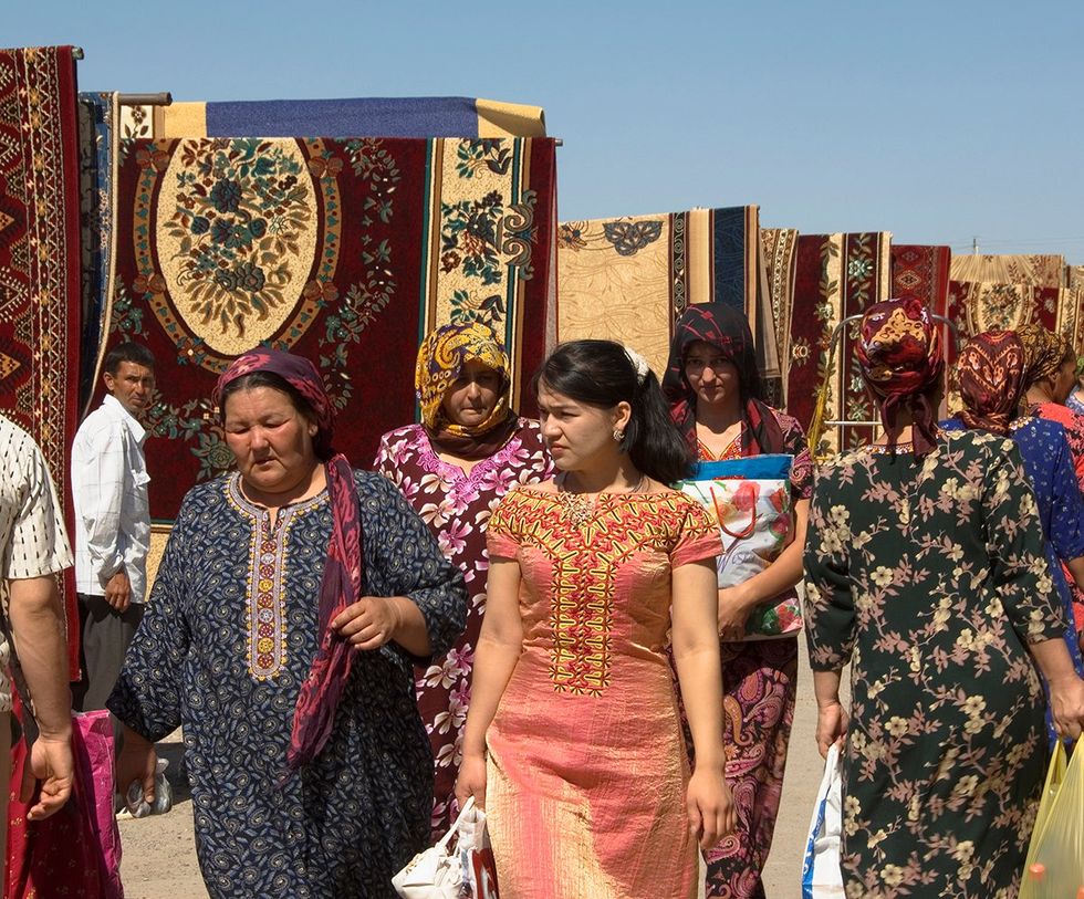 Tolkucha bazaar People wandering the alleys of the carpet market Ashgabat Turkmenistan