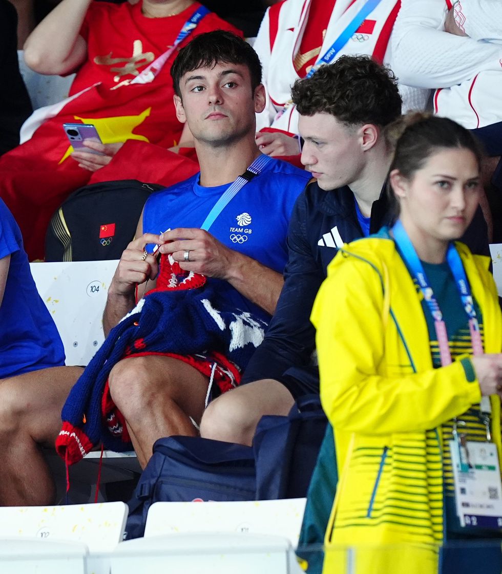 Tom Daley knitting at the 2024 Paris Olympic games.