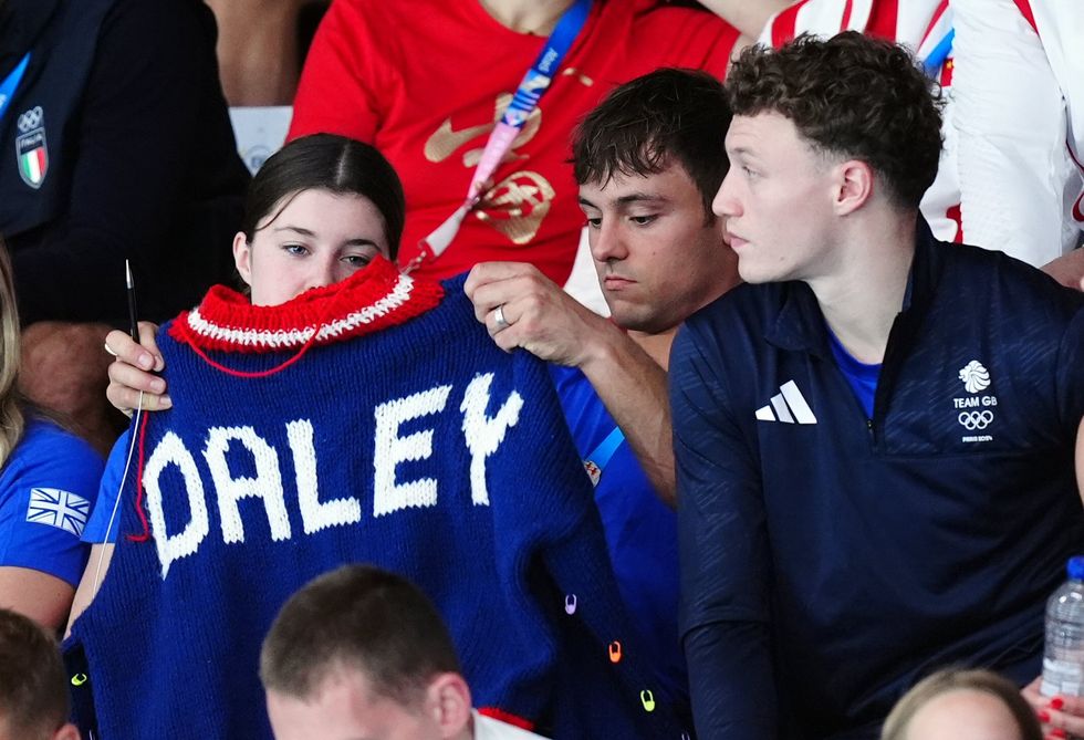 Tom Daley knitting at the 2024 Paris Olympic games.