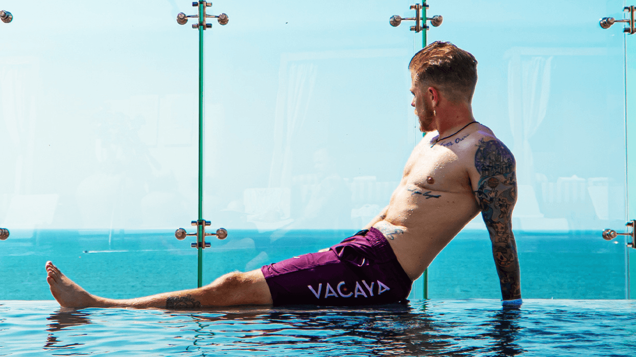 transgender man in a pool overlooking the ocean