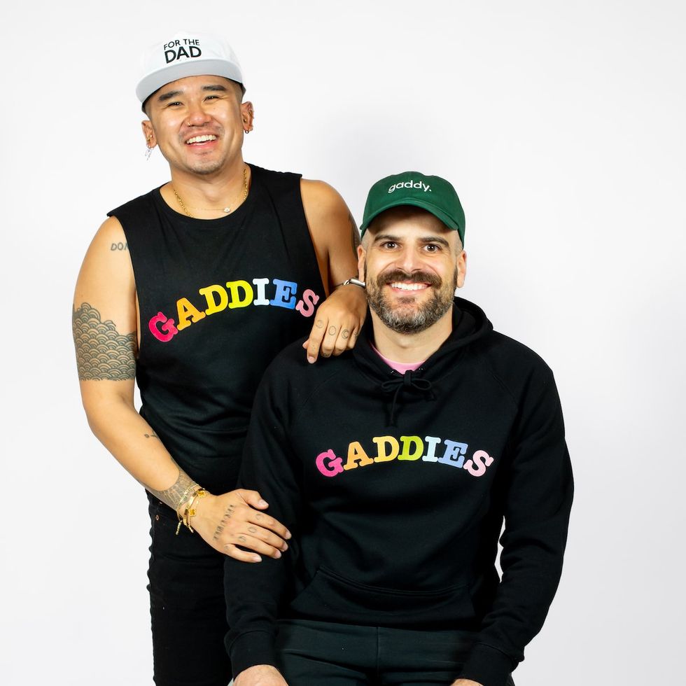 Two gay men wearing Gaddies merchandise