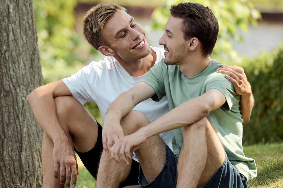 Two men sitting together