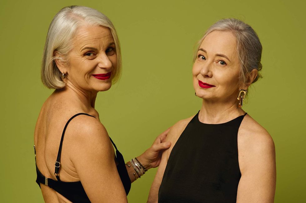 Two older women in black dresses
