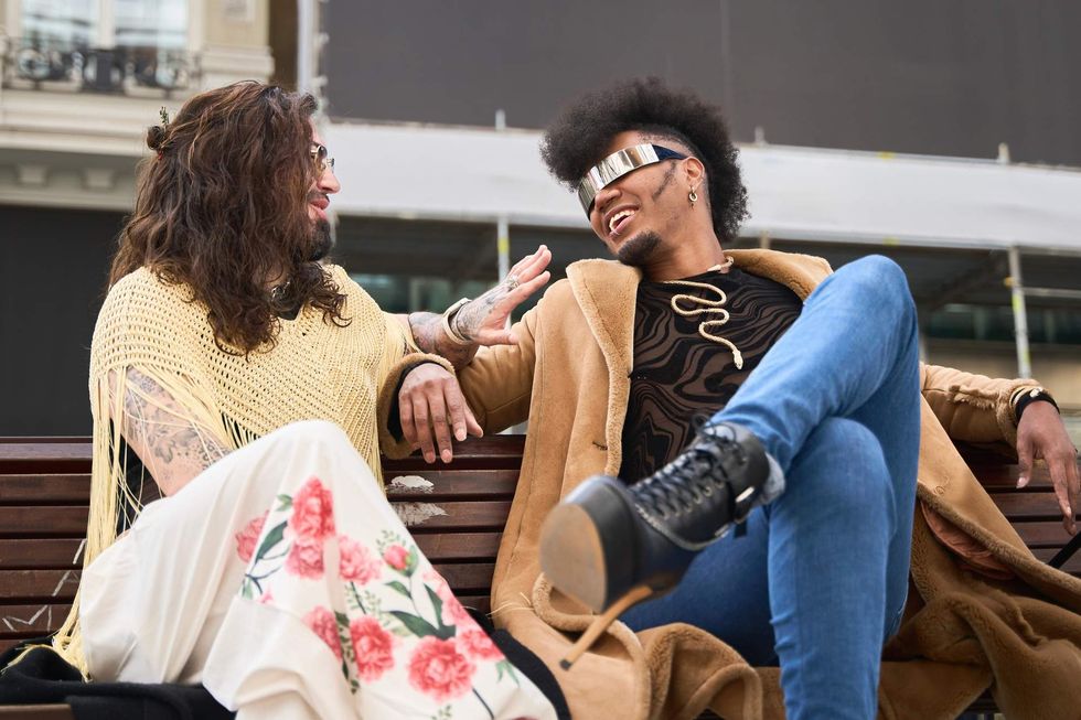 Two people sitting on a bench