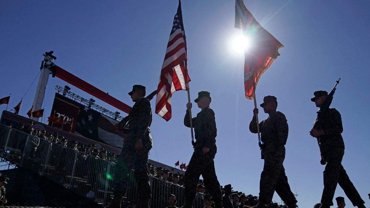U.S. military members onstage with flags