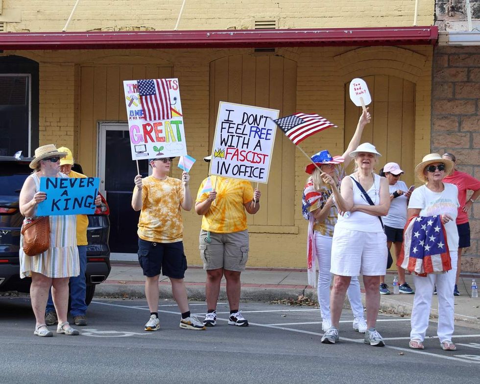 \u200bAnti-Trump protesters and Trump supporters at a No Kings rally in Kyle Texas