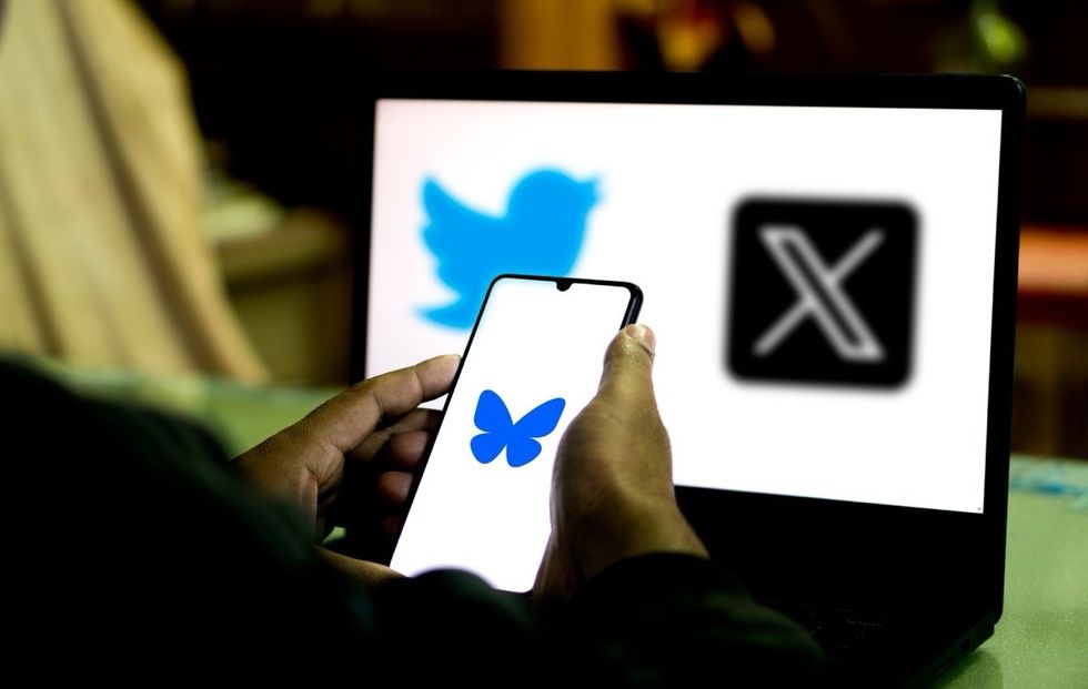 \u200bBluesky app in front of a computer displaying X/Twitter logos