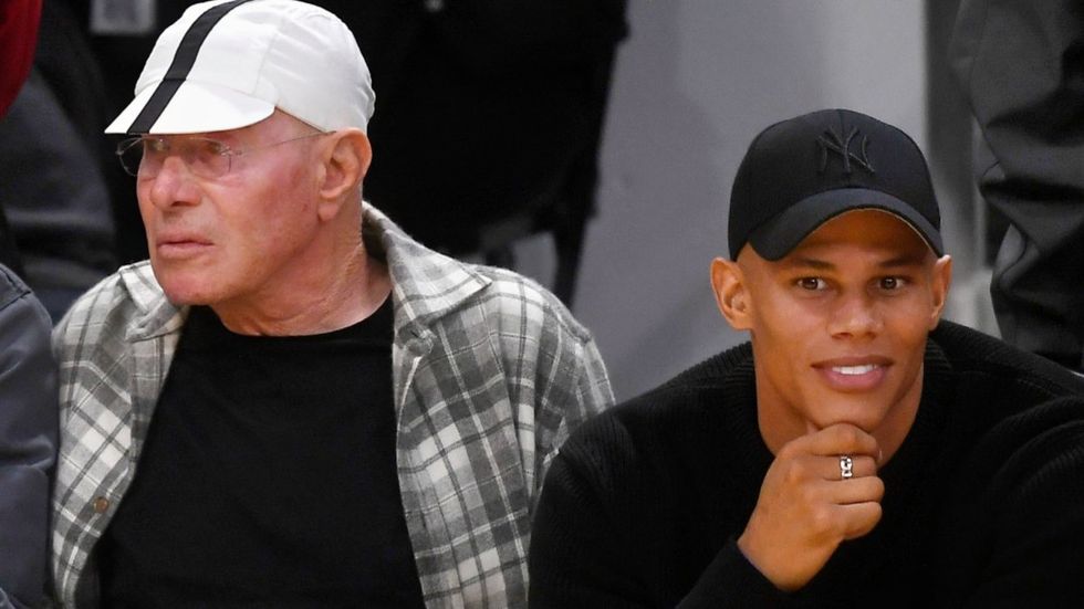 \u200bDavid Geffen and David Armstrong aka Donovan Michaels watching a basketball game