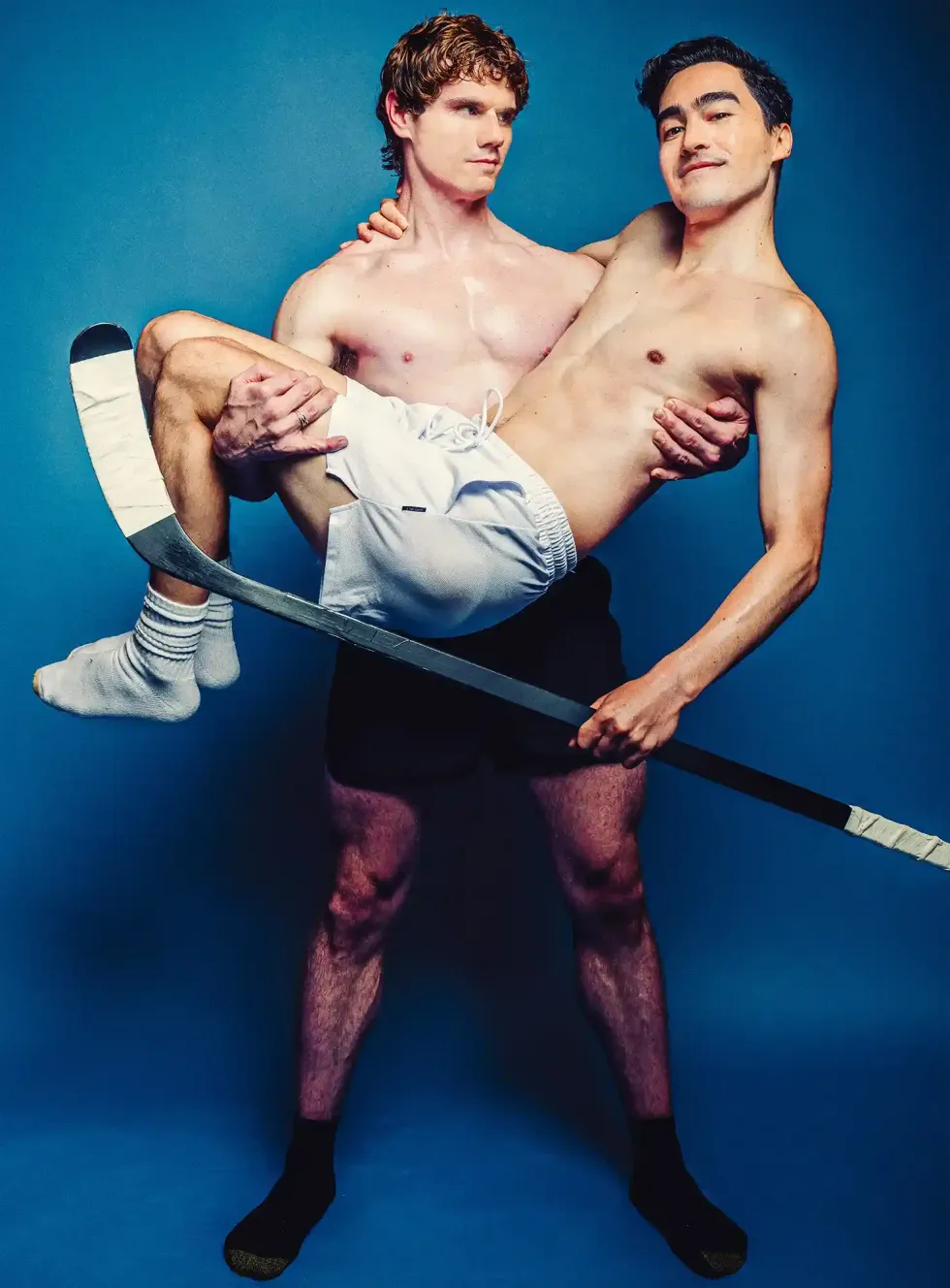 \u200bJay Armstrong Johnson holding Troy Iwata.