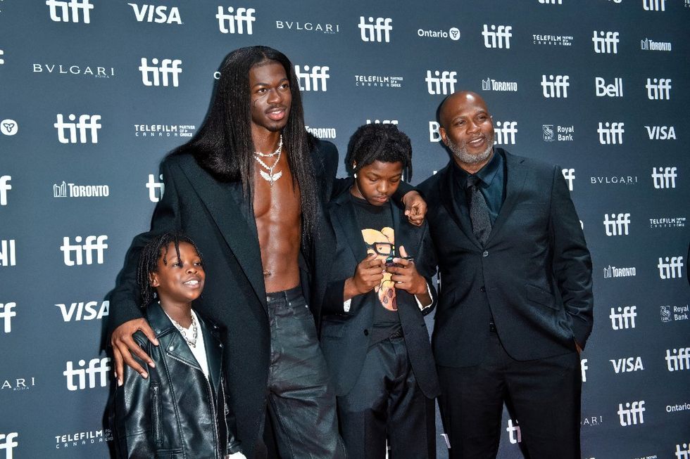 \u200bLil Nas X, his father Robert Stafford, and young family members at a screening for the Lil Nas X: Long Live Montero documentary at the Toronto International Film Festival in September 2023
