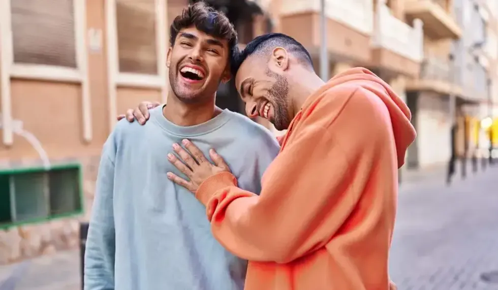 \u200bTwo gay men laughing.