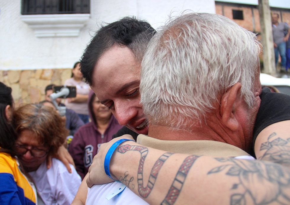 Venezuelan stylist Andry Hernandez Romero hugs his father Luis Felipe Hernandez after returning home in Capacho village Venezuela July 2025