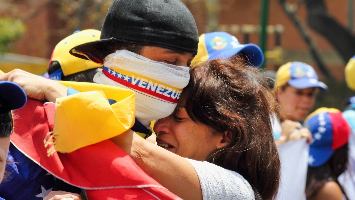 Venezuelans peacefully protest against the government for human rights violations and killings of innocent civilians