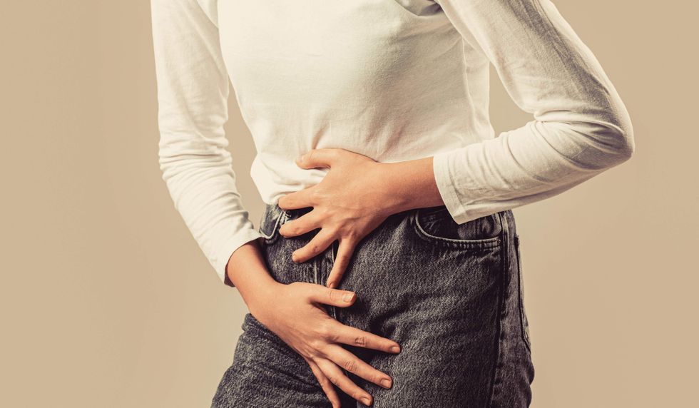 Woman holding her stomach