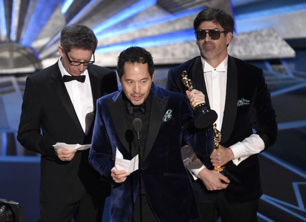 Worst Dressed: 'The Shape of Water' Producer Wearing Shades, Insane Cuffs & Sneakers