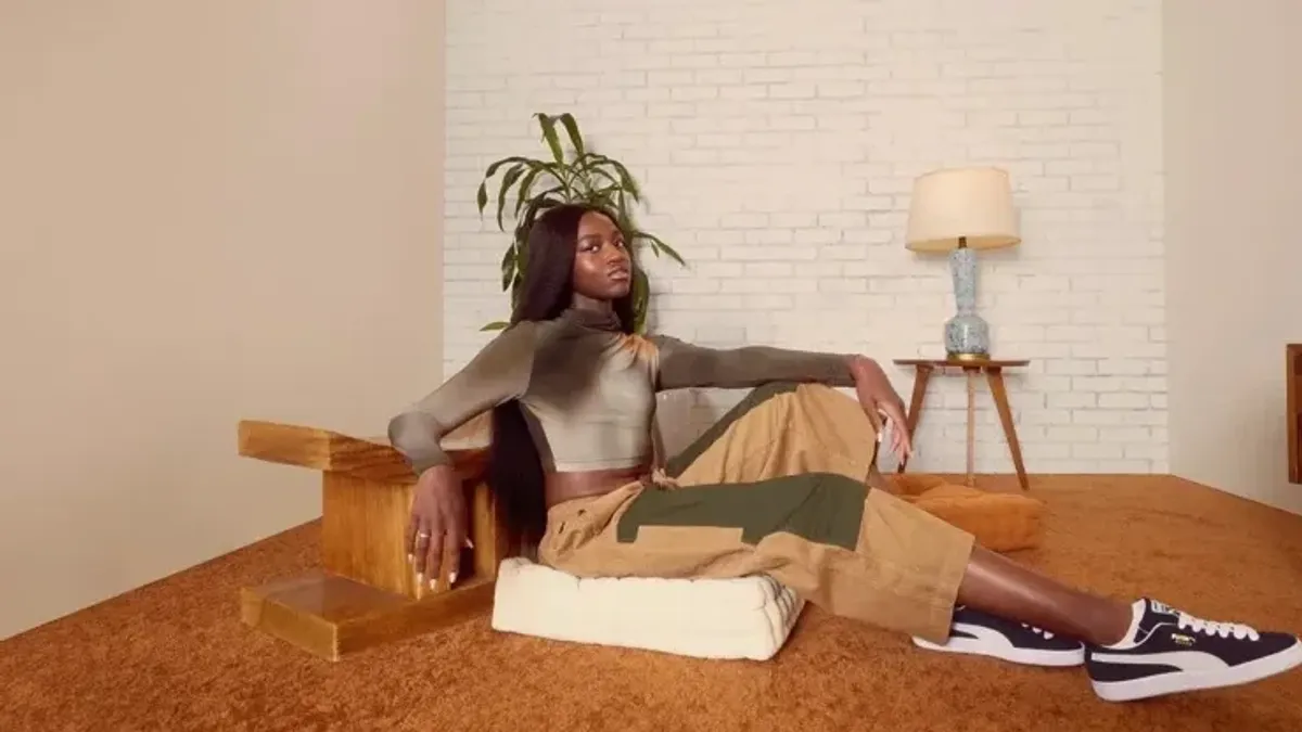 Zaya Wade sitting on the floor in an ad for Puma
