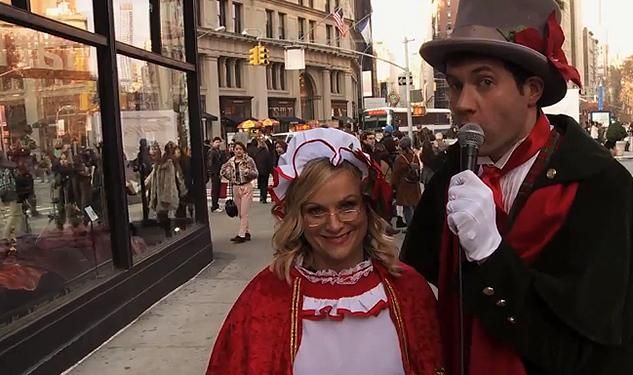 WATCH: Billy Eichner and Amy Poehler Sing Carols With Strangers
