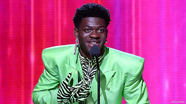 Lil Nas X wore a green suit to accept his AMA.