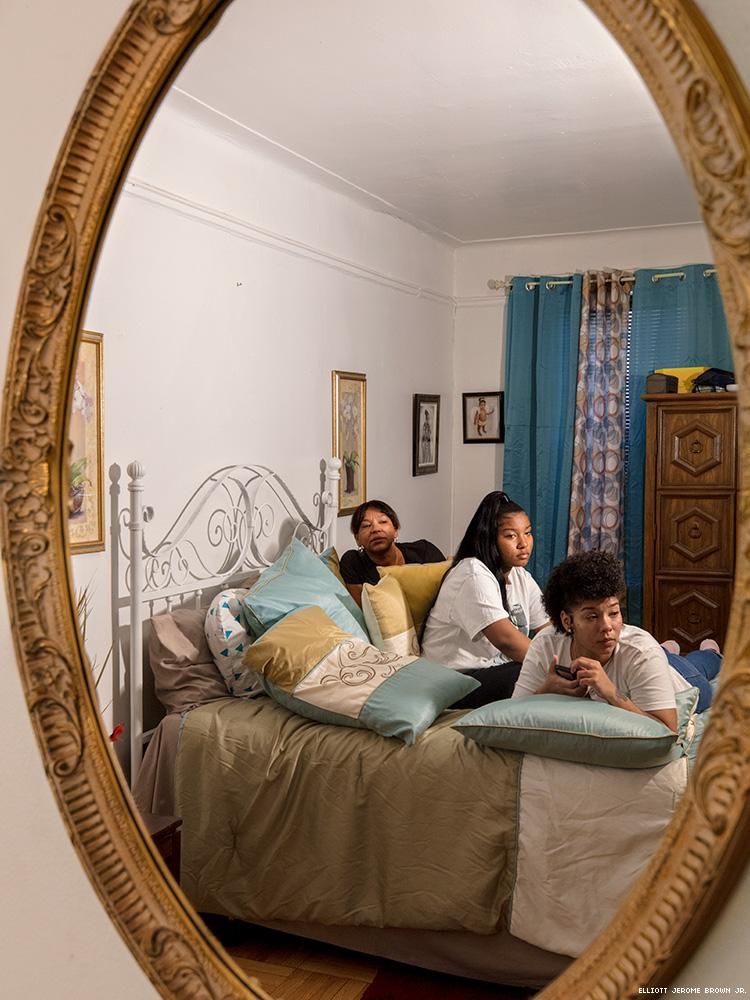 A photo of a mirror reflecting the home and family of Layleen Polanco.