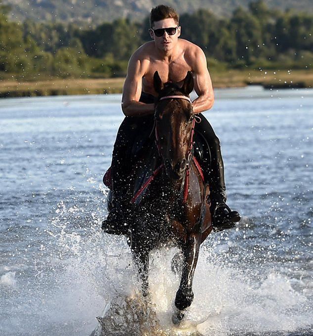 A Shirtless Zac Efron Rides Horseback
