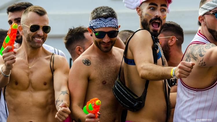 group of gay guys in swim trunks having fun