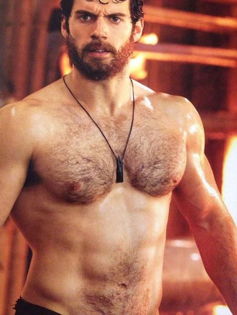 Shirtless male muscular hairy chest abs beard torn jeans