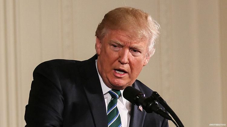 Trump on stage giving a speech.